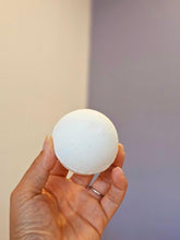 Load image into Gallery viewer, Close-up of hand holding an Infused Bath Bomb