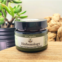 Load image into Gallery viewer, CBD Capsules in a container showcasing organic wellness benefits